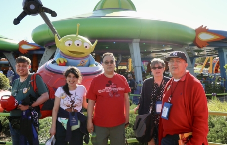 Highlight Vacations standing in front of Alien from Toy Story movie