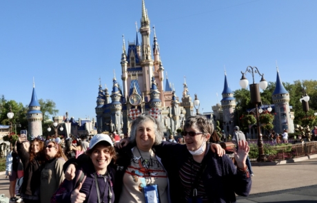 Highlight Vacations laughing in front of Cinderella's Castle at Magic Kingdom