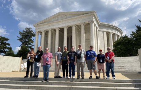 Highlight Vacations travelers in front of the Thomas Jefferson Memorial