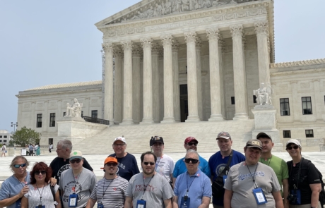 Highlight Vacations travelers & staff standing in front on the Supreme Court in DC.