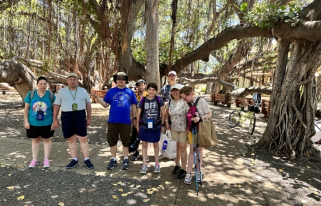 Highlight Vacations travelers standing in front of the Banyan tree