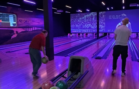 two travelers are bowling