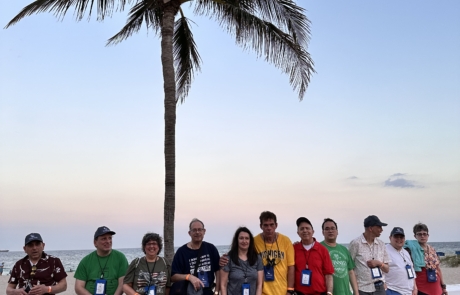 Travelers out for a beach walk in the evening.