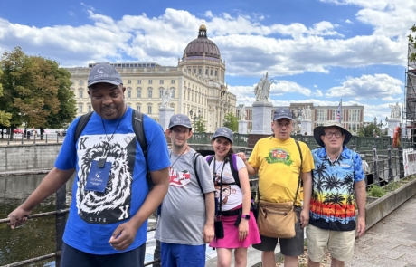 Travelers in front on the old parliament building in Berlin