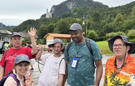 Group with Castle Neuschwanstein in the background