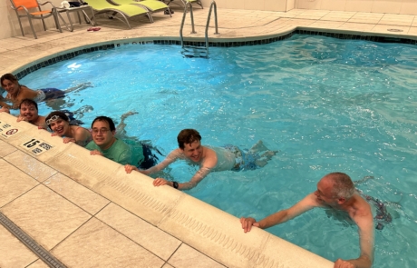 travelers getting a swimming lesson