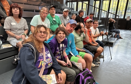 Travelers and staff waiting for a glass blowing demonstration