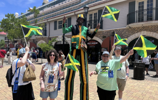 Falmouth, Jamaica - travelers with Jamaica man on stilts
