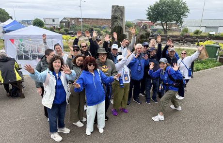 Travelers waving to the camera in Invergordon Scotland